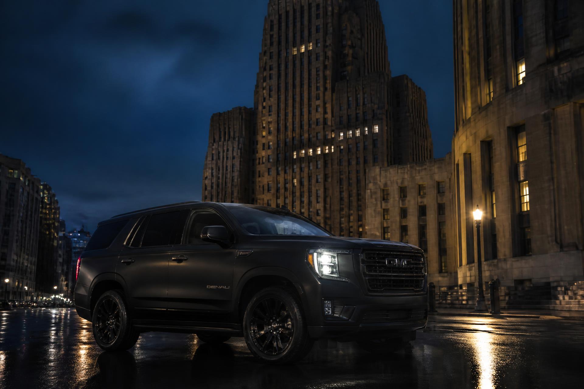 Matte black GMC Yukon parked before Buffalo City Hall at blue hour